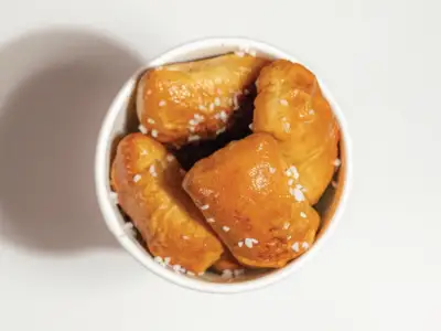 Swig Menu 86 Salted Pretzel Bites are simple, real, and delicious. 410 calories, 78 carbs, and 5 fats.